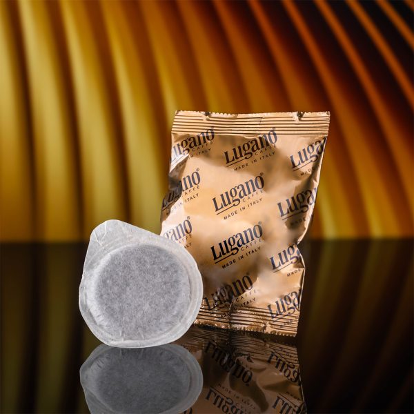 Lugano Caffè Arabica Espresso Pod and its aluminum foil in a studio set