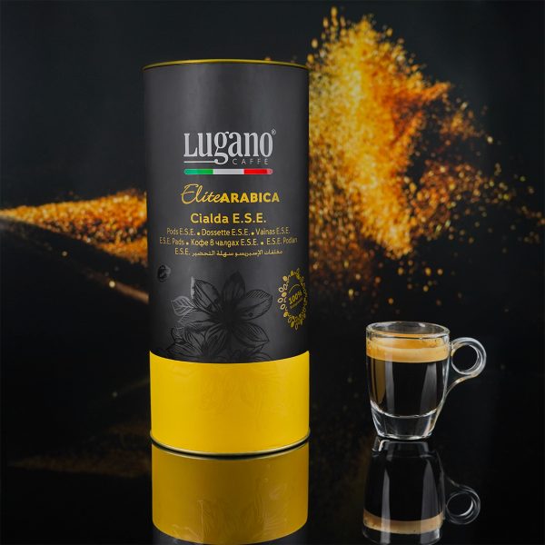 Lugano Caffè Elite Arabica Espresso Pod 18 pcs cylinder pack with a cup in a Studio Set