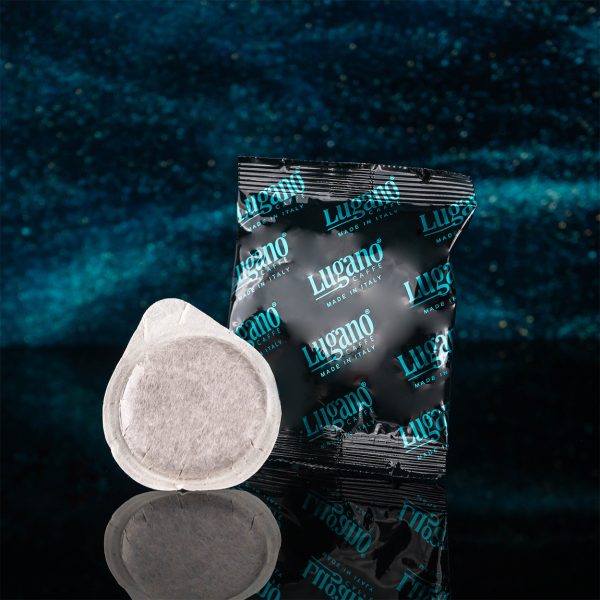 Lugano Caffè Elite Life Espresso Pod with its Aluminum Foil in a Studio Set