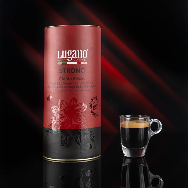 Lugano Caffè Strong Espresso Pod pack and a Cup in a Studio Set