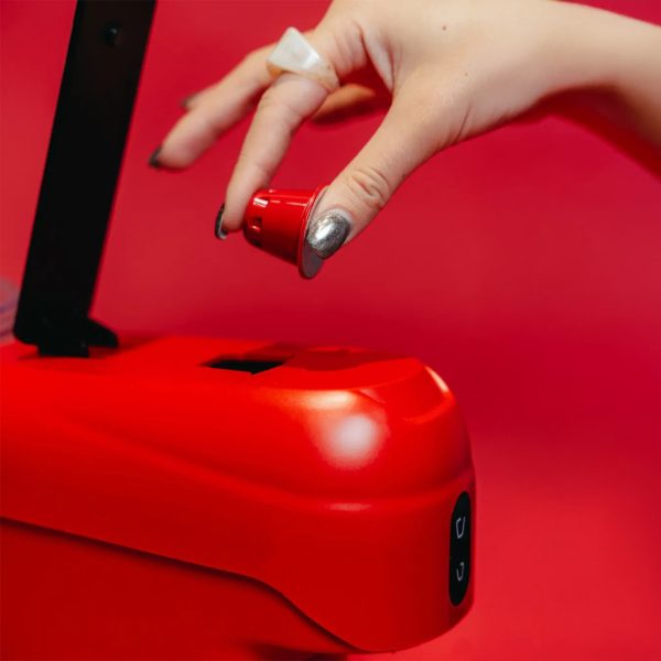 Putting Espresso Capsule in Elite Mini Espresso Machine red color